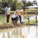 KATE WITH MEN AT POND