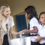 KATE SERVING FOOD TO CAMBODIAN CHILDREN