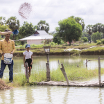 KATE FEEDING THE FISH