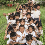 KATE HUDSON WITH GROUP OF CAMBODIAN CHILDREN