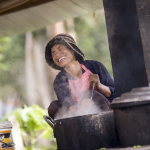 WOMAN COOKING AT CAMBODIAN SCHOOL